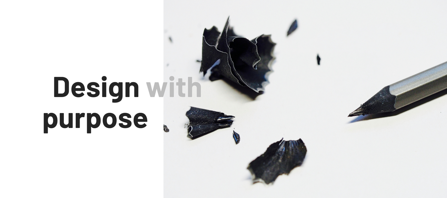 Design with a purpose and a pen on white paper